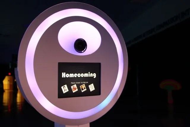 The Digital Burst booth glowing with a Homecoming start screen